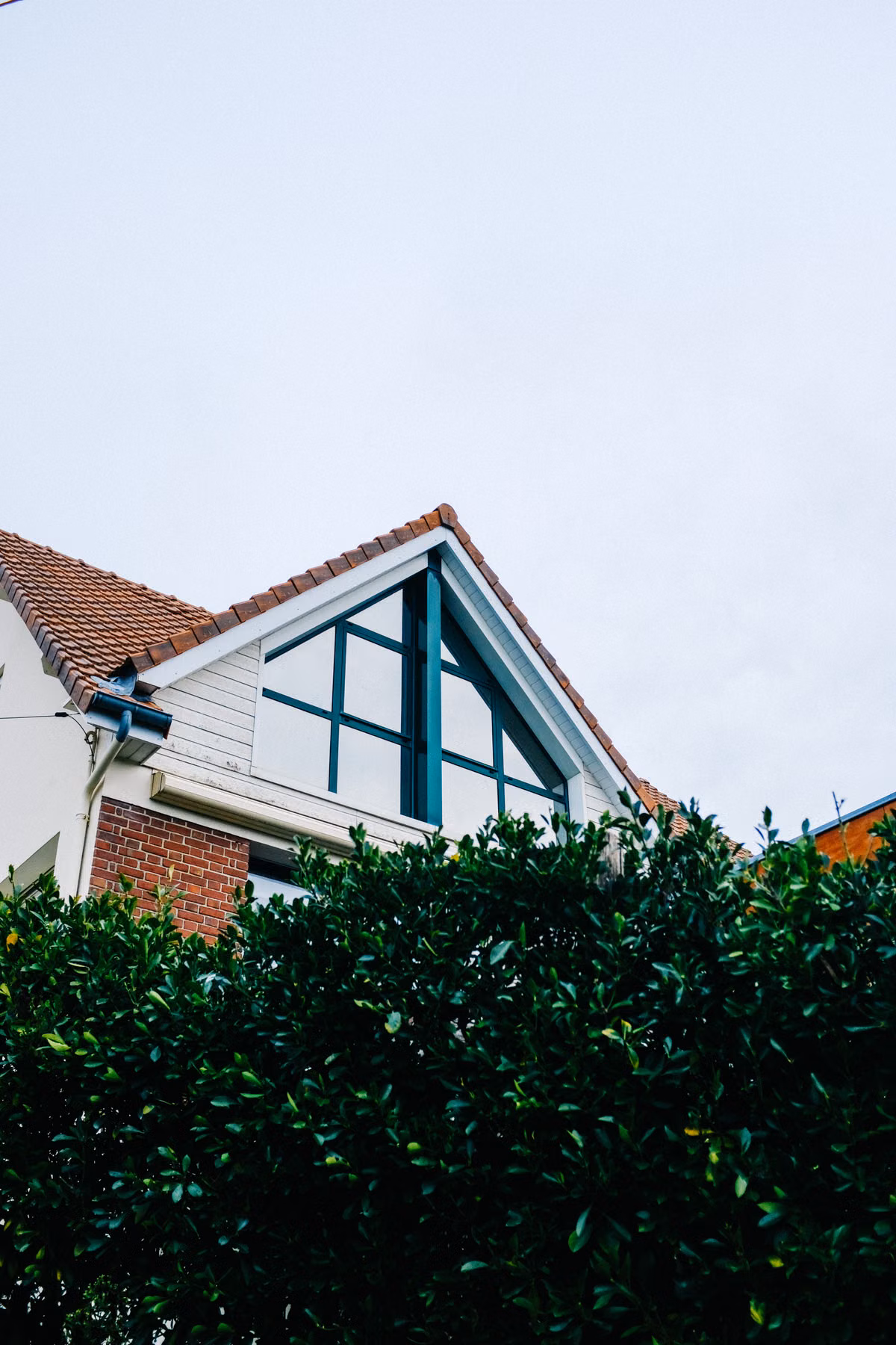 Pressure washing a colorful bungalow exterior in NoDa, Charlotte