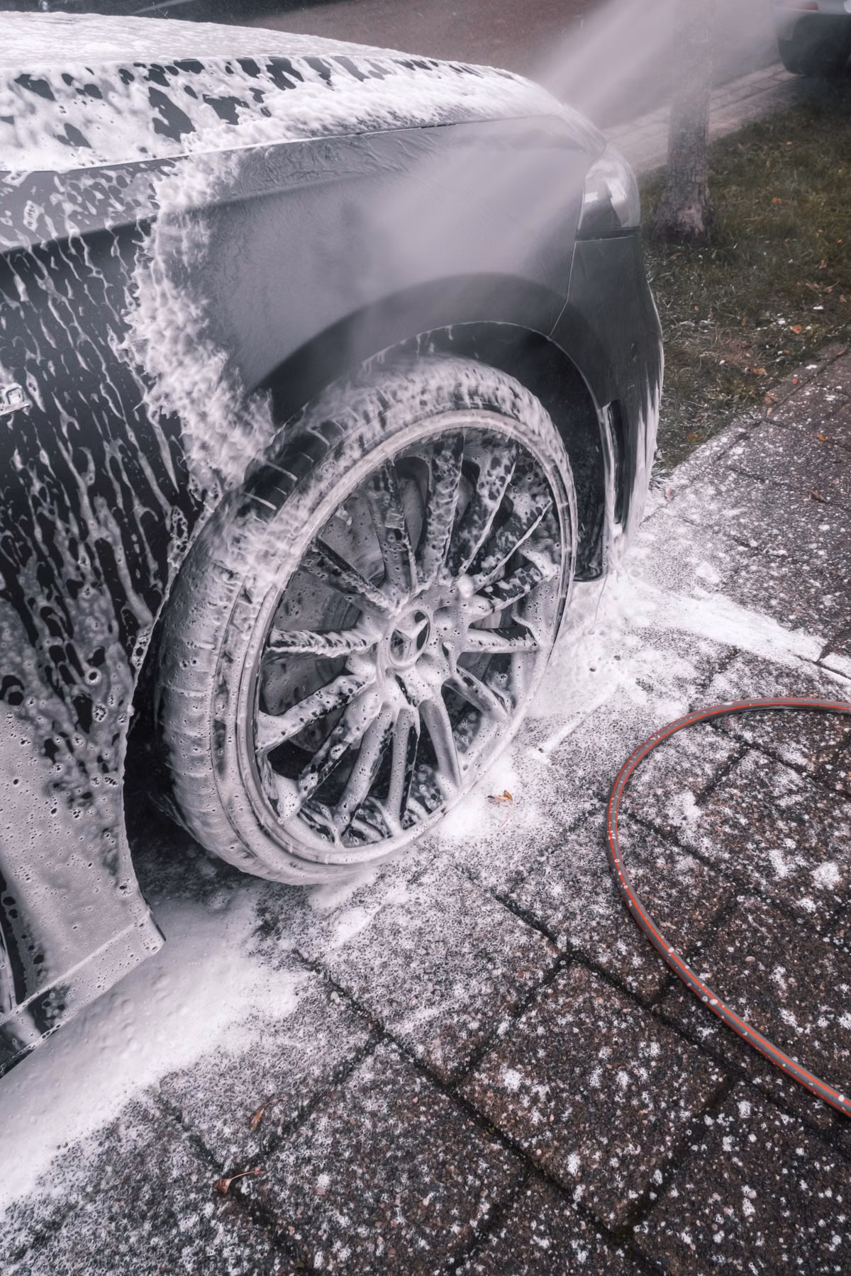 Clean residential driveway being pressure washed outside a Charlotte home