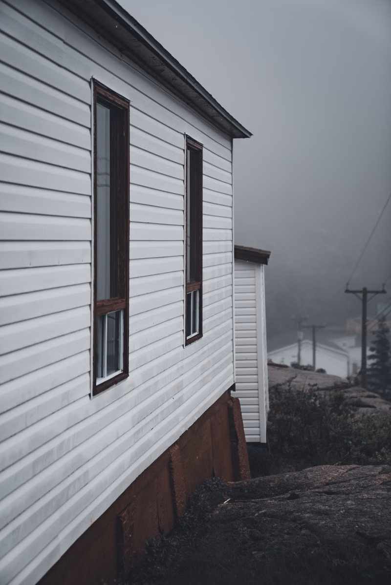 White home siding being washed